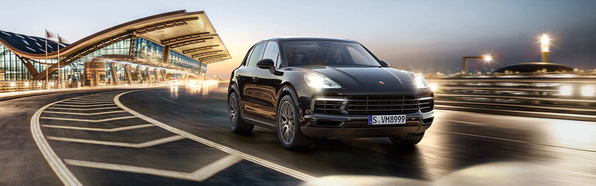Shop from Home at Porsche Towson in Towson, MD | Black Porsche Cayenne Driving on Highway at Night