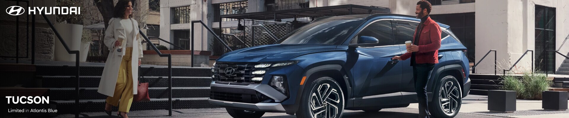 Couple getting into the Hyundai Tucson Limited in Atlantis Blue