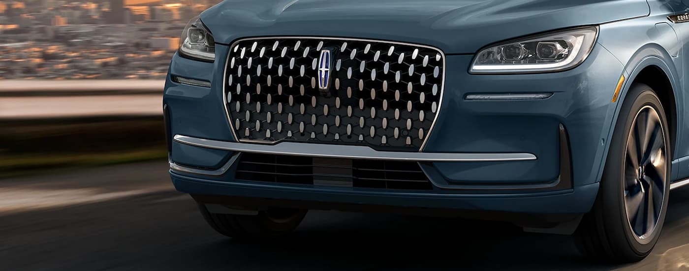 Lincoln dealer near me - 2023 Lincoln Corsair - Blue Grille.jpg A close up of the grille and headlights on a blue 2023 Lincoln Corsair.