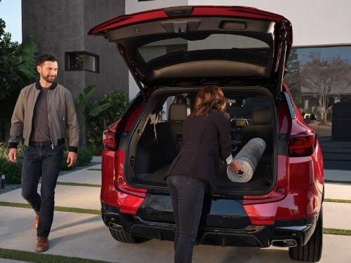 2025 Chevrolet Blazer view of woman loading bags into cargo area