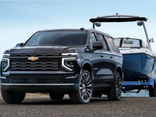 2025 Chevrolet Suburban towing a boat