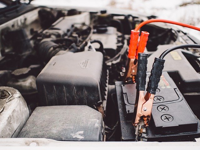 battery with jumper cables attached picture of battery service