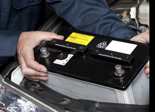 technician removing battery picture of our service manager removing battery