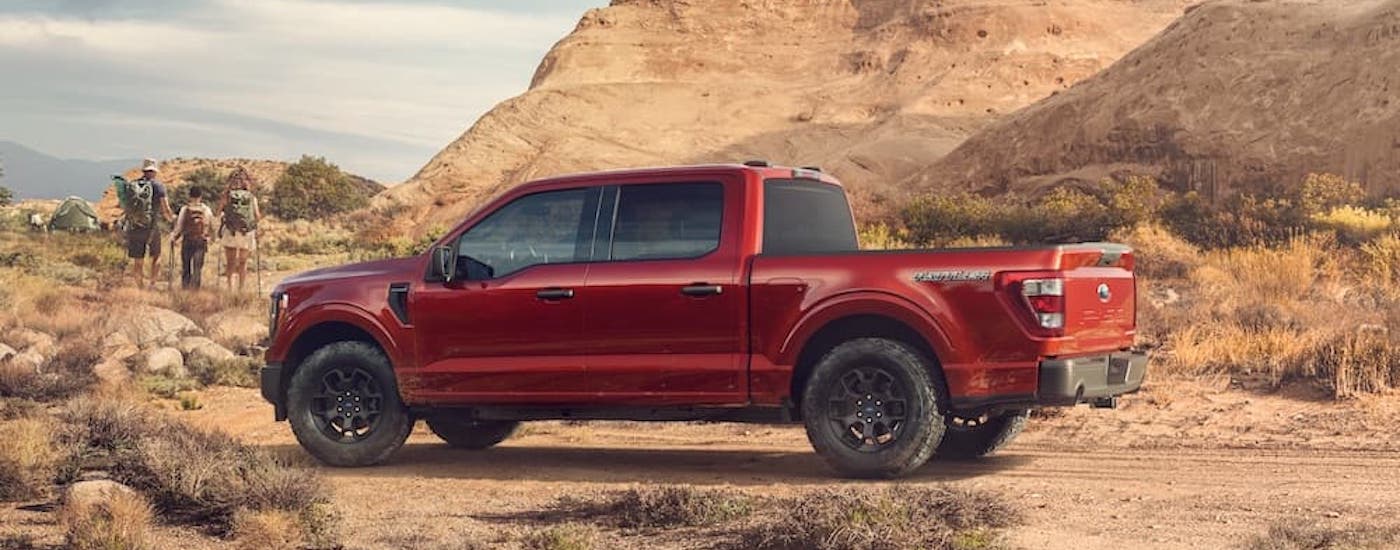 Ford Dealer wlp - 2023 Ford F-150 Rattler_03 copy.jpg A red 2023 Ford F-150 Tremor parked in the desert.