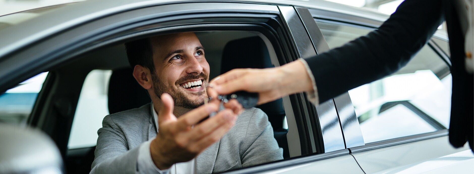 happy-customer-buying-new-car.jpg