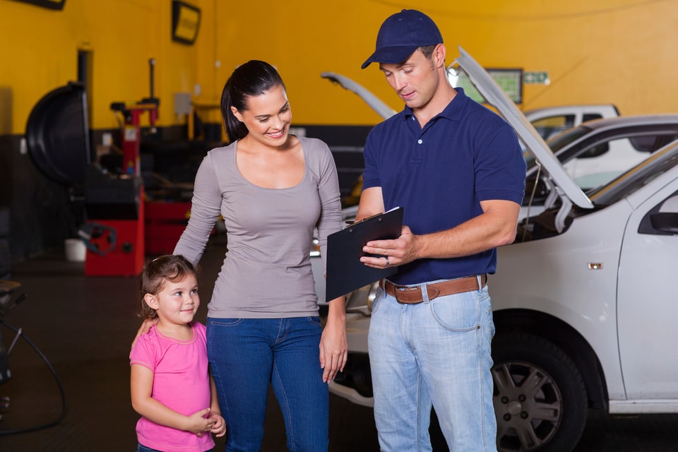 service employee with clipboard, woman and child.jpg