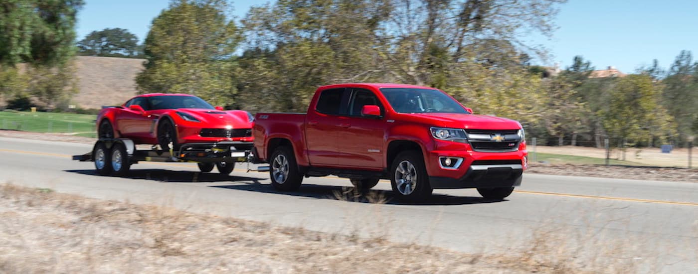 2018 Chevy Colorado - towing Corvette .jpg A red 2018 Chevy Colorado towing a red Chevy Corvette