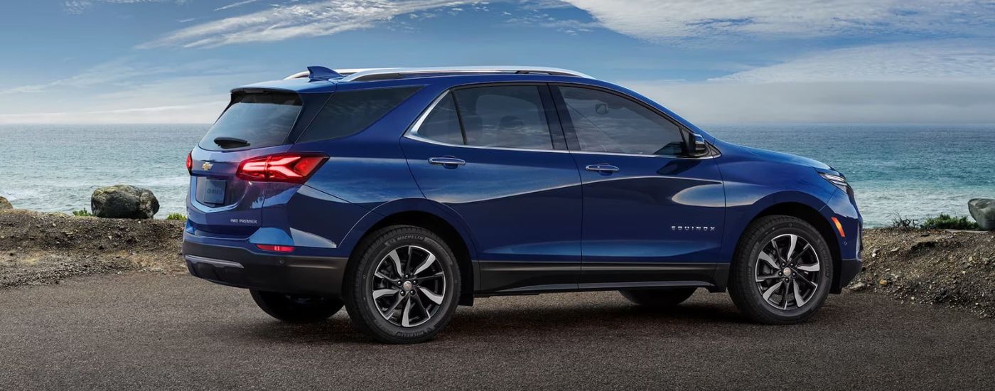 2023%20Chevy%20Equinox%20-%20Ocean.jpg Blue 2023 Chevy Equinox driving past the ocean