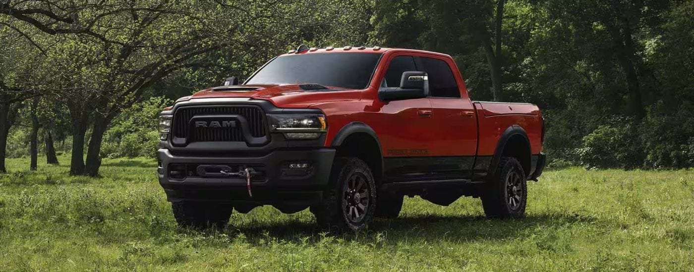 2023%20Ram%202500%20Power%20Wagon%20-%20Grass%20(1).jpg Red 2023 Ram 2500 Power Eagon parked on grass