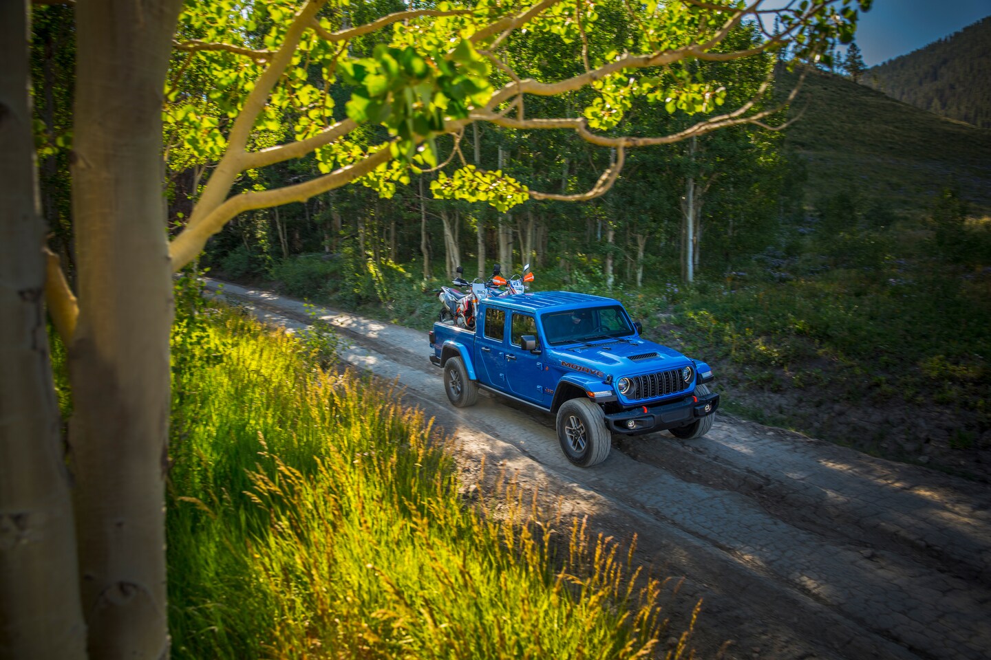 Bird's eye view of 2025 Jeep Gladiator with two dirt bikes in the bed