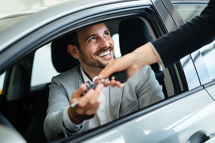 Man-in-car-with-keys.png