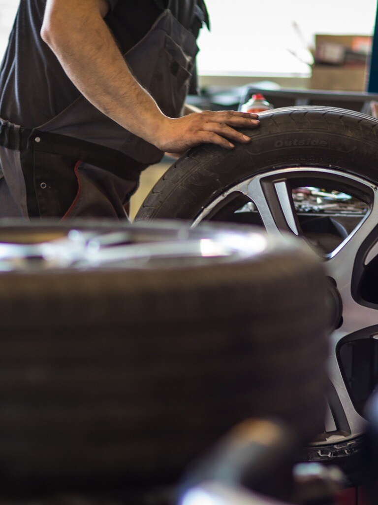 wheel-balancing-or-repair-and-change-car-tire-at-auto-service-garage-picture-id1029218760.jpg