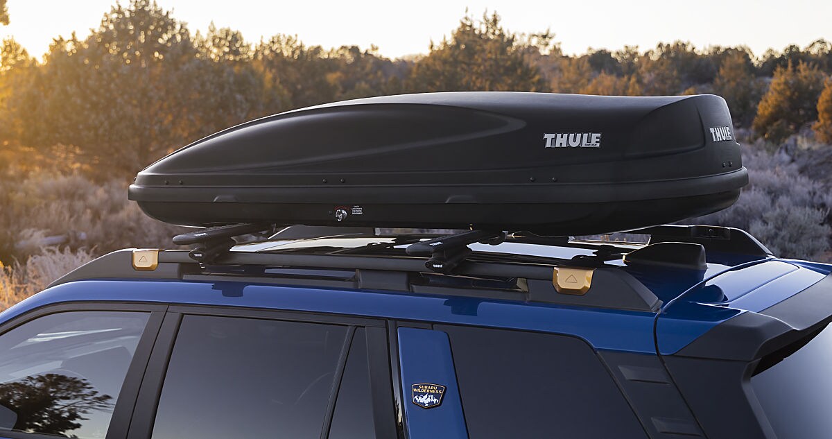 Side profile of a Certified Pre-Owned Subaru Outback in Wayne showing the rugged roof rails and ground clearance.