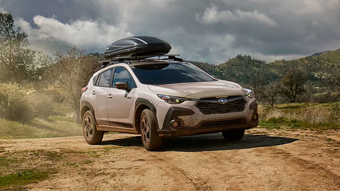 Rear view of a 2027 Subaru Crosstrek Wilderness tackling rugged terrain near Ramsey, NJ.