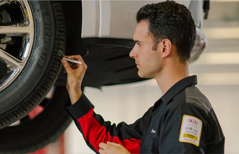 Tire Tech Checking Tread Depth.png