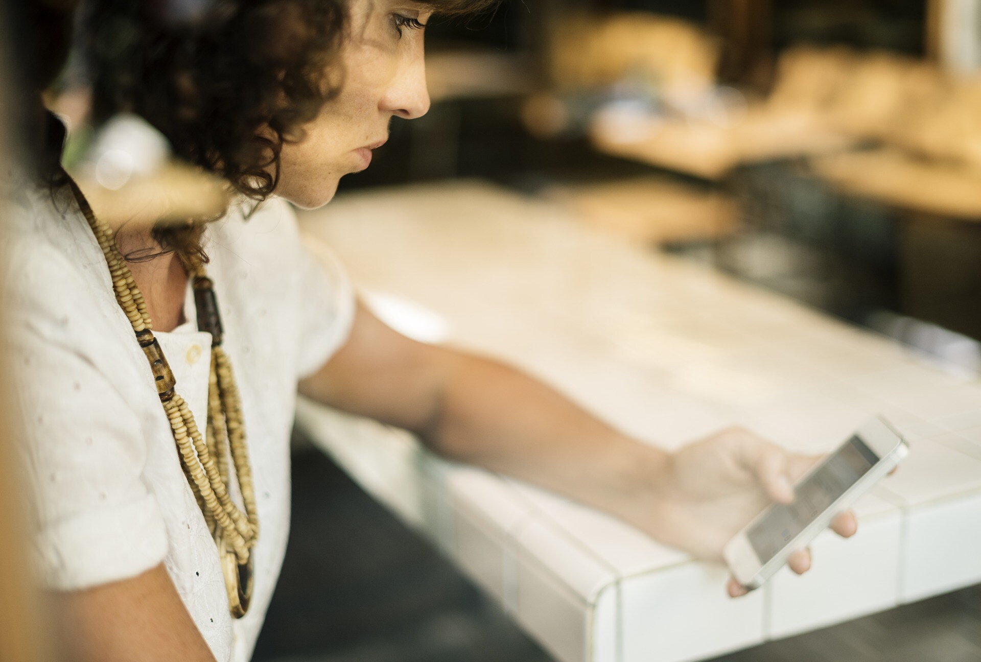 woman looking at her mobile phone.jpg