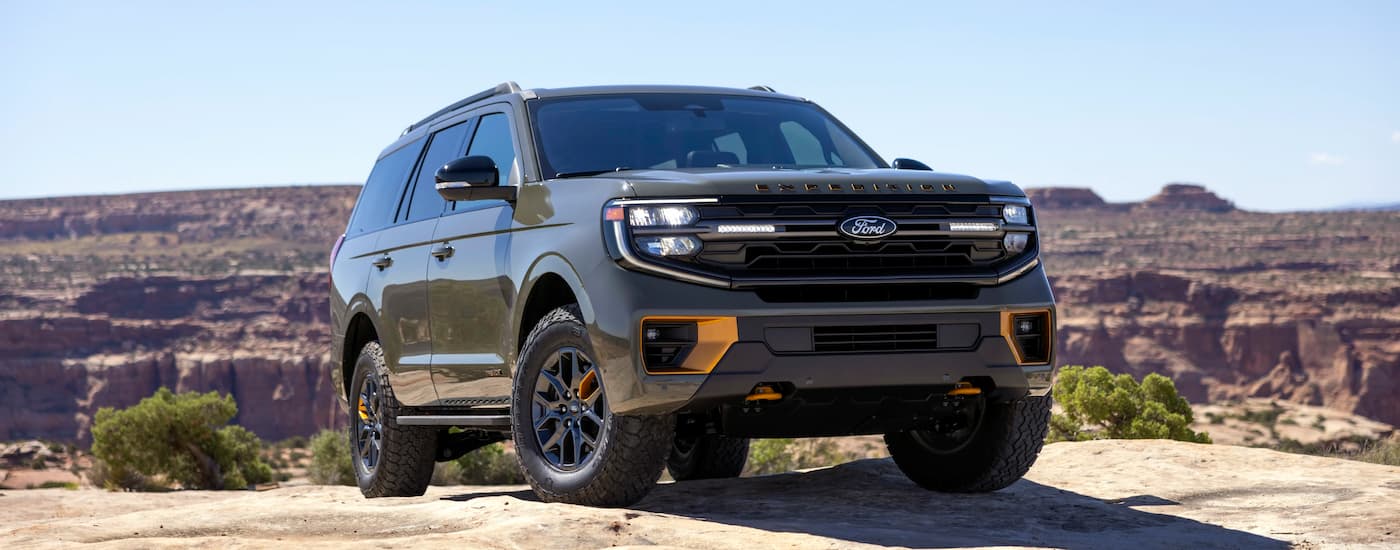 Green 2025 Ford Expedition Tremor driving off-road.