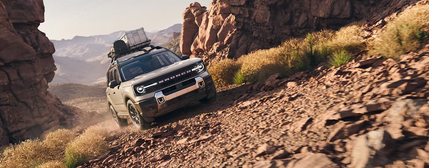 Ford%20Bronco%20Sport%20for%20Sale%20Near%20Marion%202025%20Ford%20Bronco%20Sport%20-%20White%20Offroading%20Hill.jpg White 2025 Ford Bronco Sport off-roading on a steep rocky trail