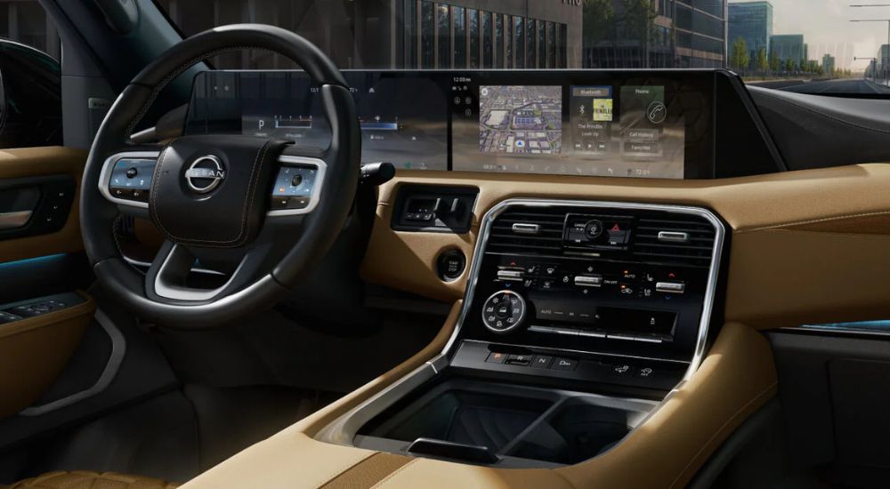 Dual digital displays in a 2025 Nissan Armada Platinum Reserve available at Nissan dealers.