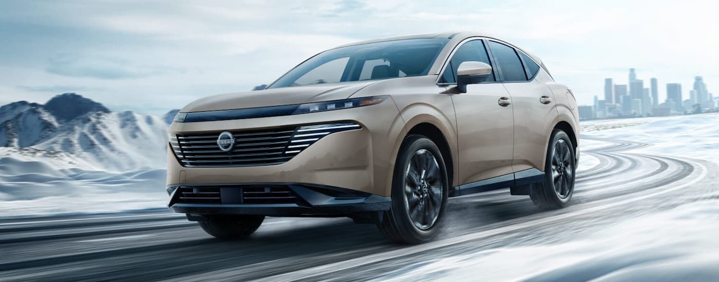 Nissan%20Murano%20for%20Sale%20Near%20Findlay%20-%202025%20Nissan%20Murano%20-%20White%202%20(1).jpg Tan 2025 Nissan Murano for sale near Findlay driving around a bend.