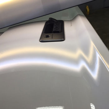 Large dent on liftgate after repair at Reliable Collision Center in Springfield Missiouri
