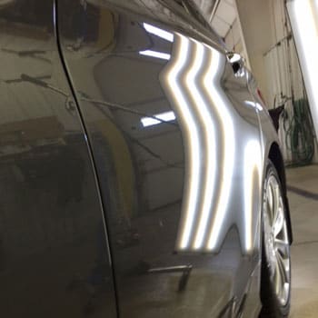 Small dent in rear car door after repair at Reliable Collision Center in Springfield Missiouri