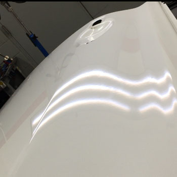 Large dent on door after repair at Reliable Collision Center in Springfield Missiouri