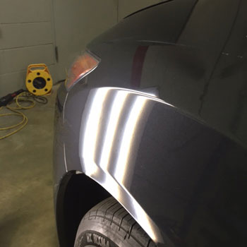 Dent on front wheel arch after repair at Reliable Collision Center in Springfield Missiouri