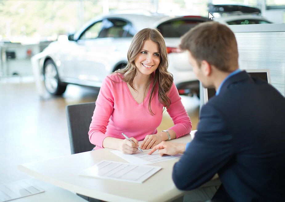 Rensselaer Honda team member reviewing paperwork with a customer during a financing or sales discussion.