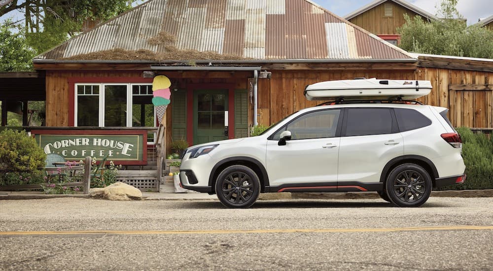 Woodbridge Subaru Forester Dealer - 2023 Subaru Forester - Coffee.jpg A white 2023 Subaru Forester is shown parked near a coffee shop after visiting a Woodbridge Subaru Forester dealer.