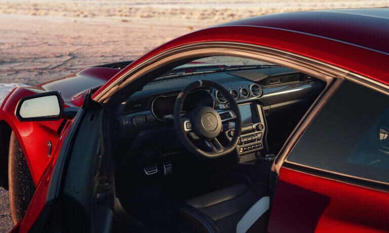 2020 Ford Mustang Driver Side Door Open Showing the Stearing Wheel and Dash
