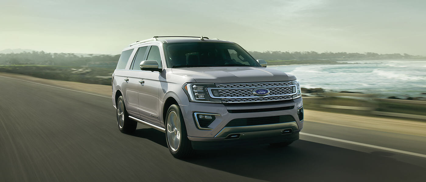 2021 Ford Expedition driving in front of water