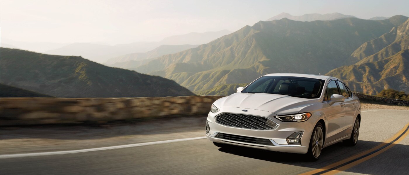 White 2020 Ford Fusion driving on road