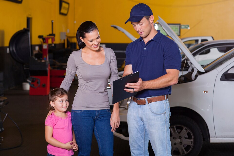 service employee with clipboard, woman and child.jpg