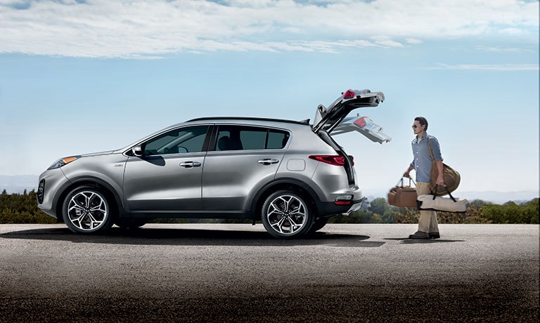 2020 Kia Sportage exterior side view with hatch open