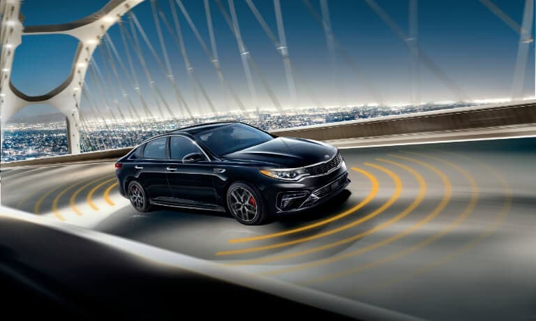 2020 Kia Optima driving on the Highway with collision sensors