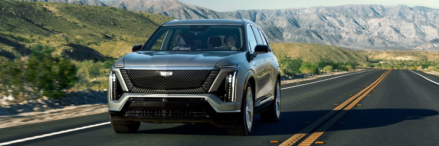 CADILLAC VISTIQ SUV driving down a mountain road new CADILLAC VISTIQ