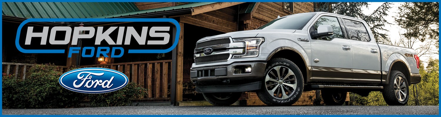 A Ford Raptor, Ford Edge, and Ford Fusion A Ford Raptor, Ford Edge, and Ford Fusion