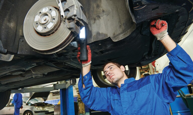 Mechanic fixing brakes Maintenance and service on vehicle