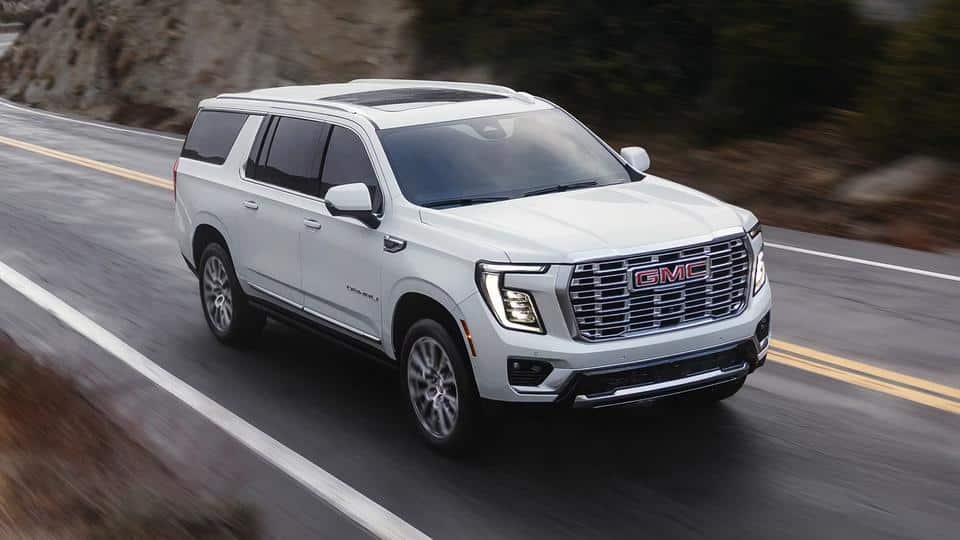 A 2026 GMC Yukon driving composedly on a highway.