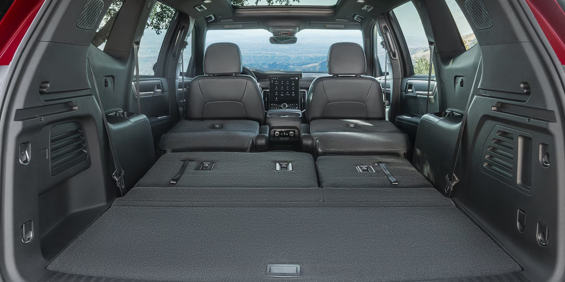 2026 GMC Acadia interior cabin view showcasing its large screen.