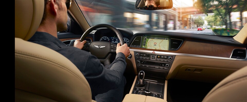 Man behind wheel of Genesis driving.jpeg