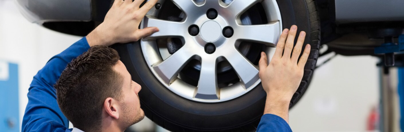 man -inspecting a tire_b.jpg