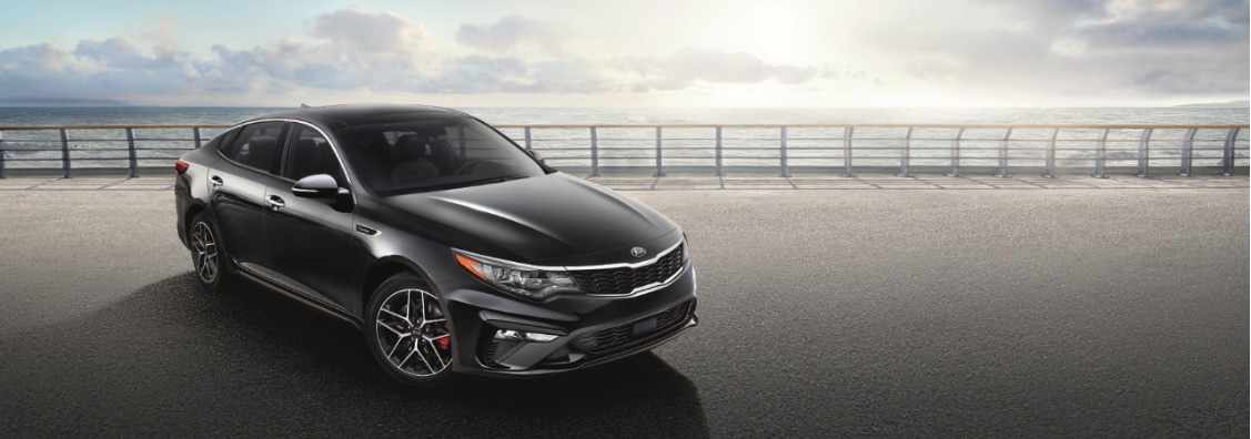 Black Kia Optima front passenger side view