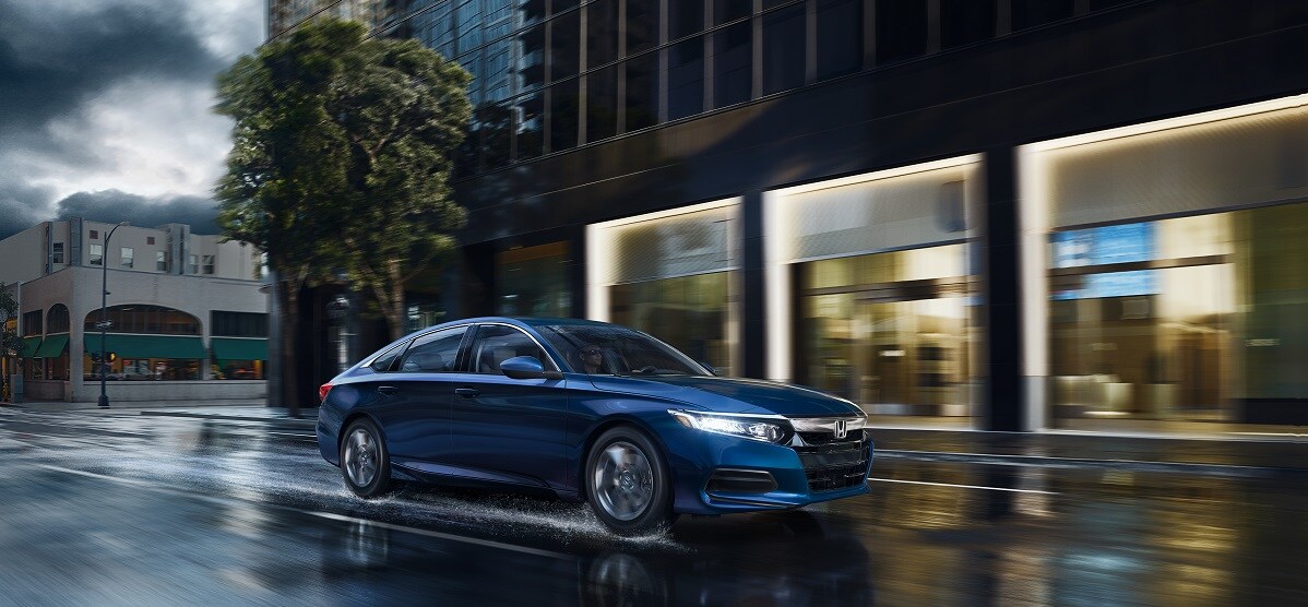 2019-Honda-Accord-LX-Sedan-L01.jpg blue 2019 honda accord driving on a wet road