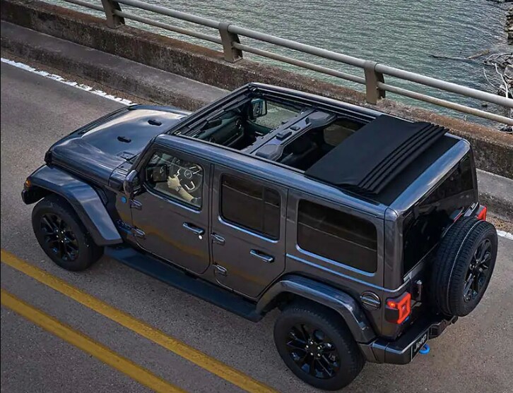 2023 jeep wrangler 2023 jeep wrangler zooming over a bridge