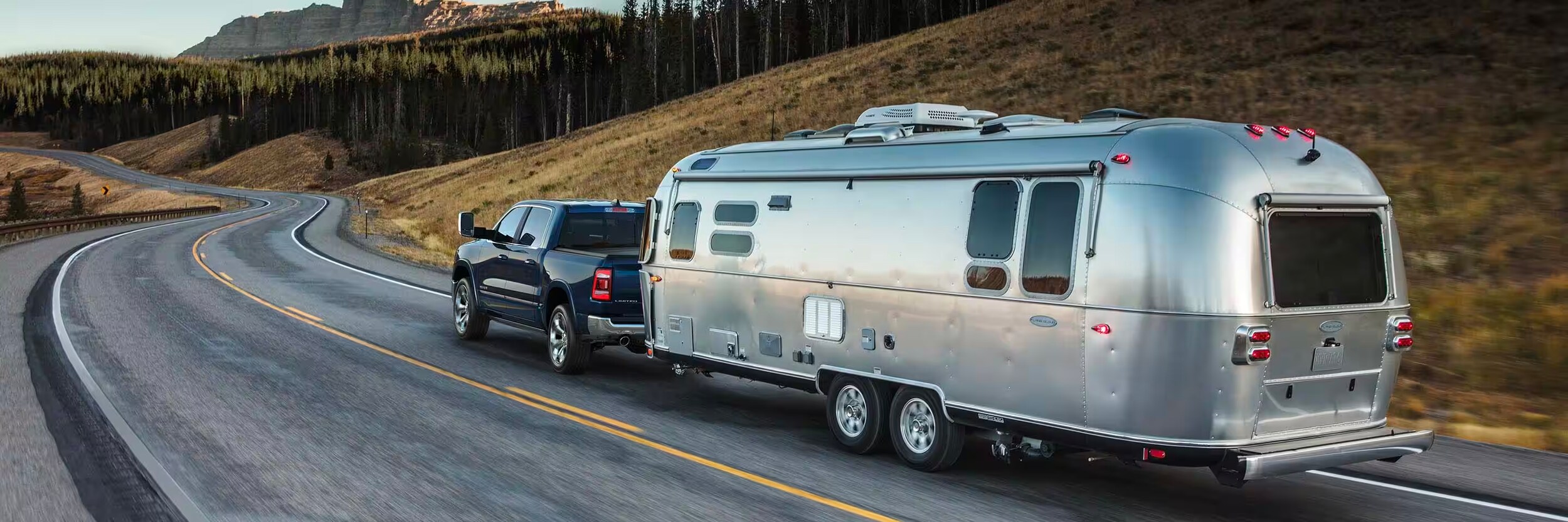 2024 RAM 1500 2024 RAM 1500 towing an airstream on the highway