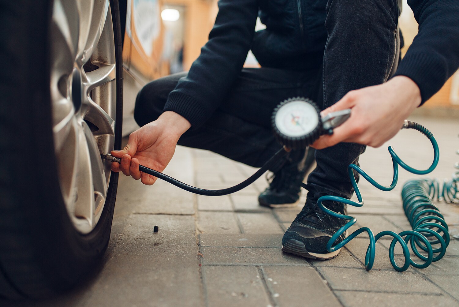 How to check your tires' health at Sale Auto Mall of North Kinston | Service technician checking tire pressure