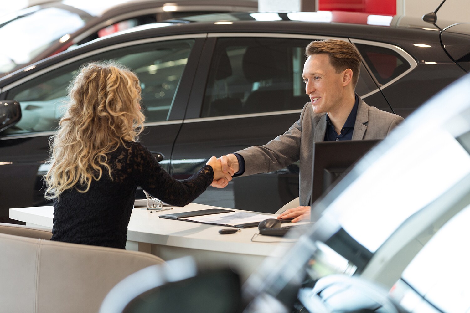 Documents to bring when purchasing a car at Sale Auto Mall in New Kinston | Customer making a deal and buying a car with a sales associate