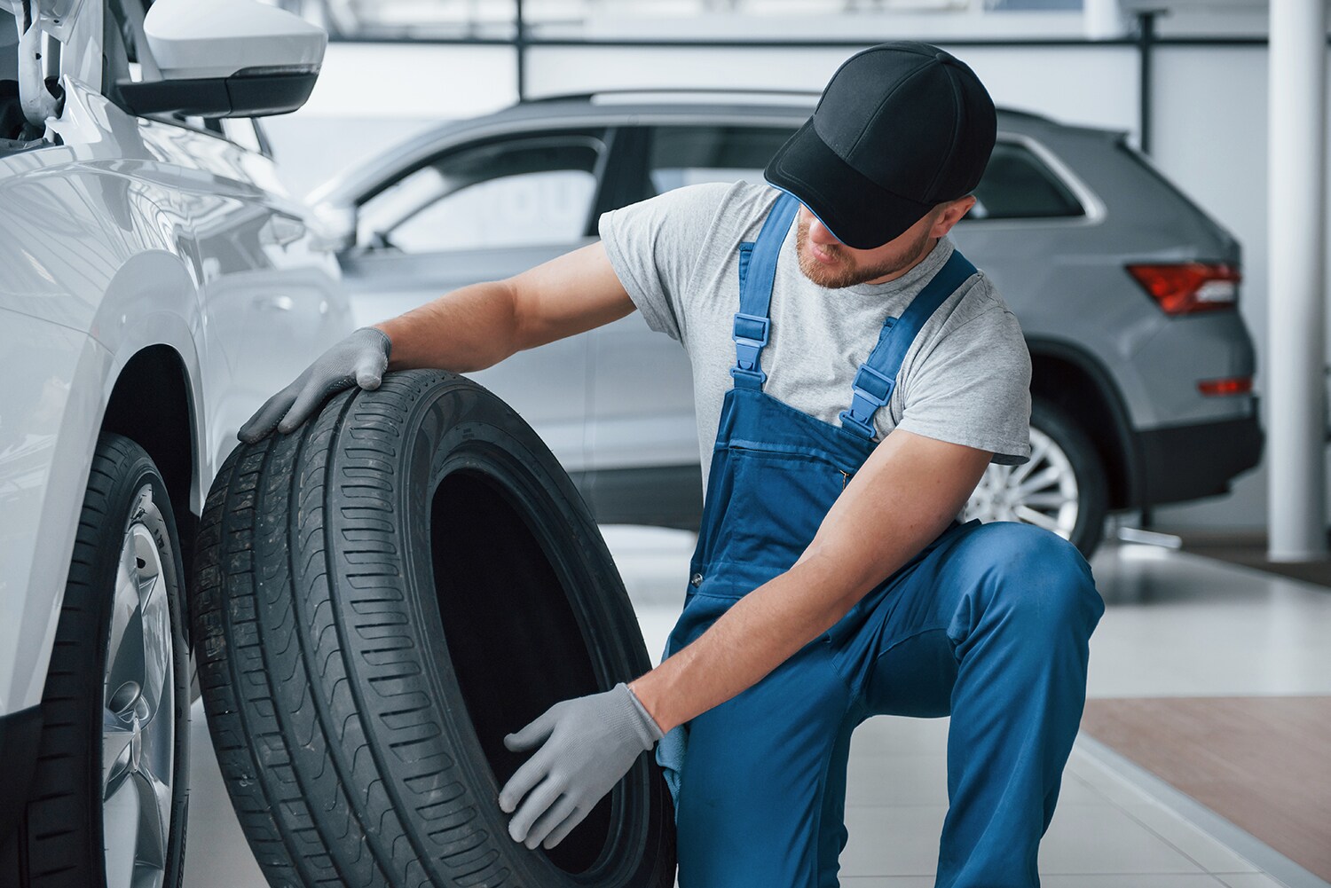 How to check your tires' health at Sale Auto Mall of North Kinston | Service technician inspecting tire from vehicle